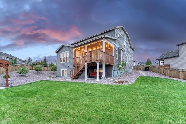 6470 Amur Ct, Castle Rock, CO 80108 - back of house at dusk with stairway and a deck