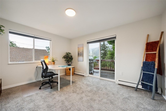 carpeted home office featuring a baseboard radiator