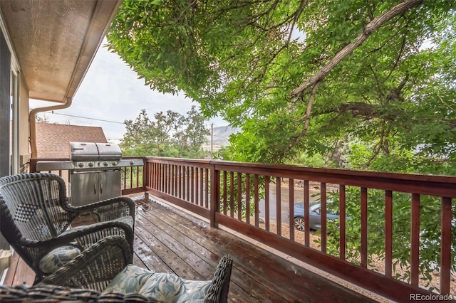 wooden deck featuring area for grilling