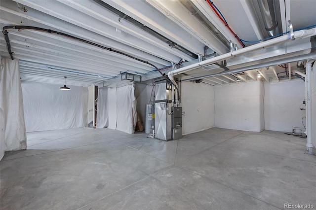 basement with electric water heater and heating unit