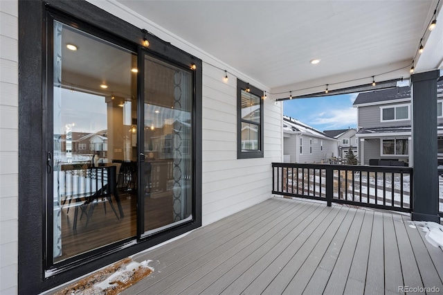 wooden deck featuring a residential view