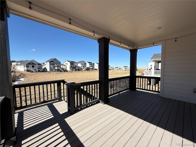 wooden terrace with a residential view