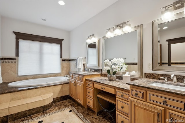 full bathroom featuring a bath and vanity