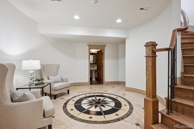 living area with visible vents, stairs, baseboards, and recessed lighting