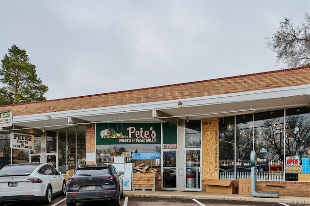 view of property featuring uncovered parking