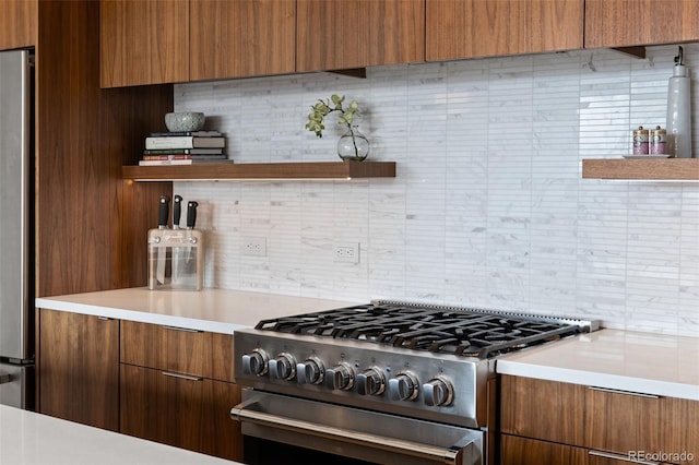 3233 Tejon St Unit 305, Denver, CO 80211 - kitchen featuring stainless steel appliances, tasteful backsplash, open shelves, light countertops, and modern cabinets