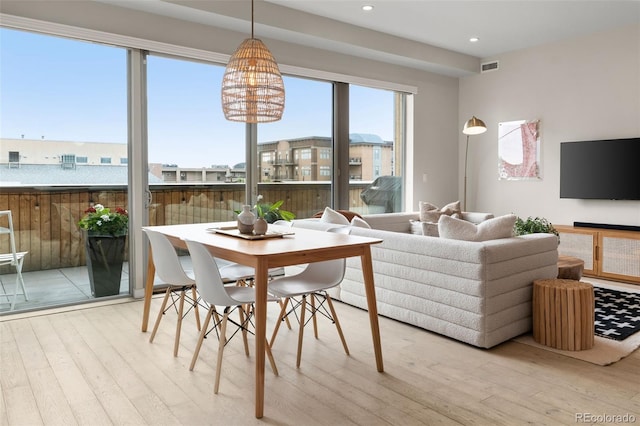 3233 Tejon St Unit 305, Denver, CO 80211 - dining space featuring hardwood / wood-style flooring, recessed lighting, and a chandelier
