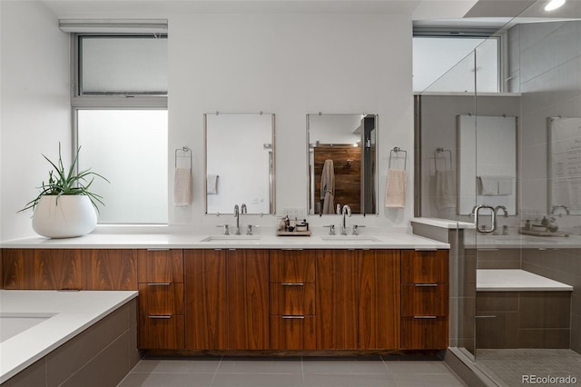 3233 Tejon St Unit 305, Denver, CO 80211 - bathroom featuring double vanity, a shower stall, and tile patterned floors