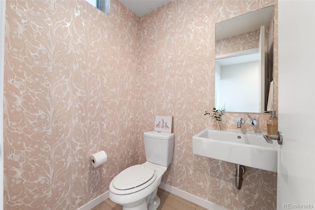 3233 Tejon St Unit 305, Denver, CO 80211 - bathroom with wallpapered walls and baseboards