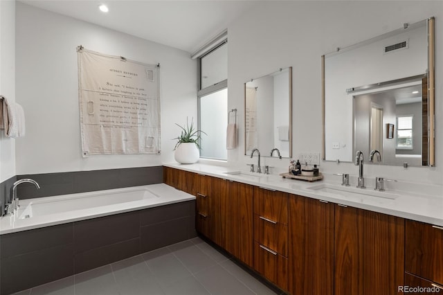 3233 Tejon St Unit 305, Denver, CO 80211 - bathroom with double vanity, a garden tub, and tile patterned floors