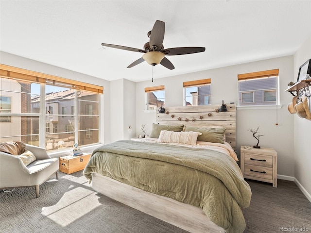 bedroom featuring a ceiling fan, carpet, and baseboards