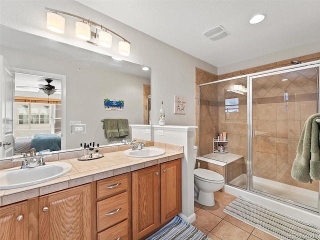 full bathroom featuring ensuite bathroom, a stall shower, a sink, and tile patterned floors