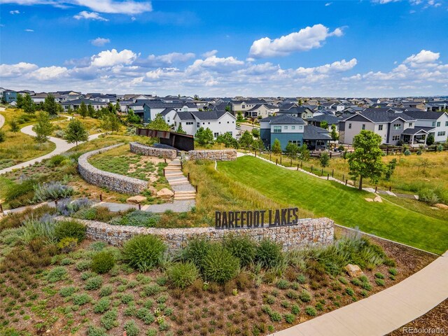 view of property's community with a yard