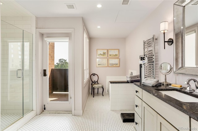 1133 Race St Unit 5A, Denver, CO 80206 - full bathroom featuring a stall shower, radiator, visible vents, vanity, and recessed lighting