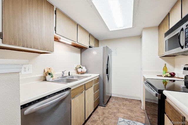 kitchen with light brown cabinets, sink, and stainless steel appliances