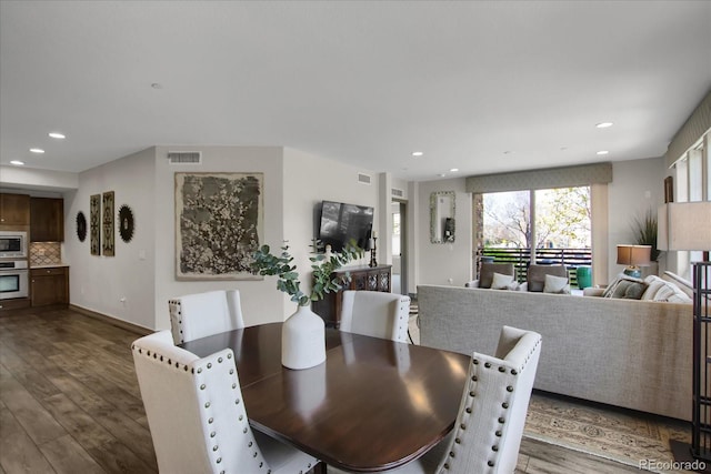 dining area featuring visible vents, wood finished floors, and recessed lighting