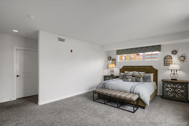carpeted bedroom with baseboards and visible vents