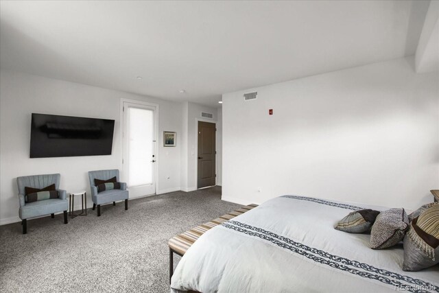 carpeted bedroom with baseboards and visible vents