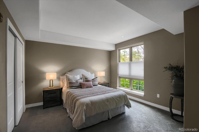 bedroom featuring carpet flooring and baseboards