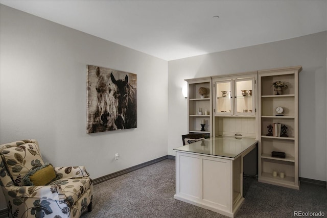 home office featuring dark colored carpet and baseboards