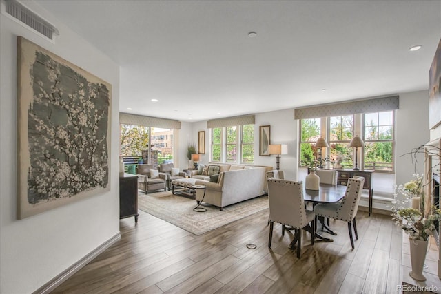 dining space featuring visible vents, wood finished floors, and recessed lighting