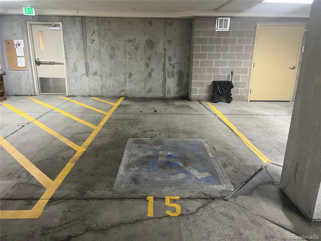 parking garage with a wood stove and visible vents
