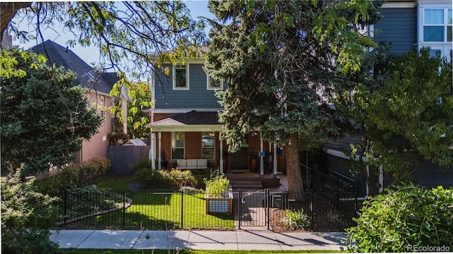 view of property hidden behind natural elements with a front lawn