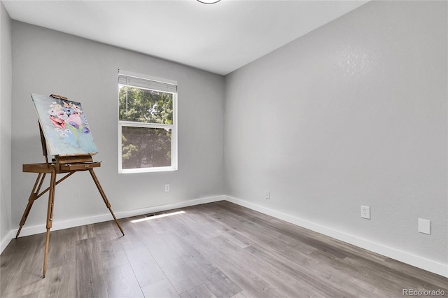 11757 W Tufts Pl, Morrison, CO 80465 - empty room featuring wood finished floors and baseboards