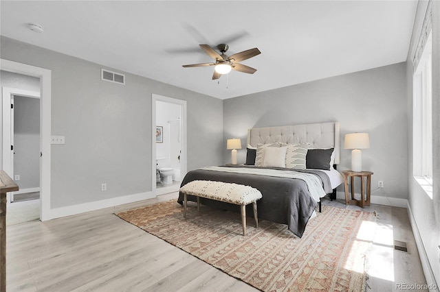 11757 W Tufts Pl, Morrison, CO 80465 - bedroom featuring wood finished floors, ensuite bath, baseboards, and ceiling fan