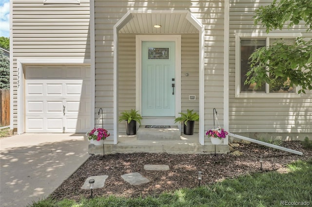 11757 W Tufts Pl, Morrison, CO 80465 - property entrance with an attached garage and driveway
