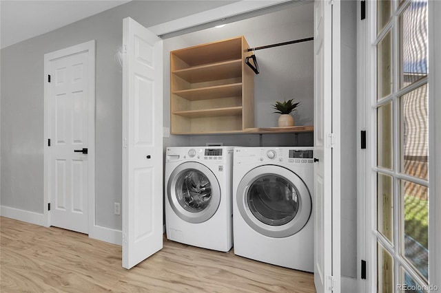 11757 W Tufts Pl, Morrison, CO 80465 - laundry area featuring light wood-style flooring, washing machine and clothes dryer, baseboards, and plenty of natural light