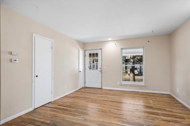 foyer entrance with light hardwood / wood-style flooring