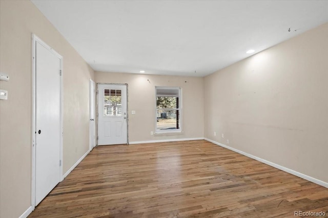 spare room with wood-type flooring