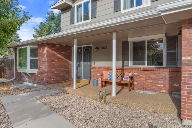 doorway to property with covered porch