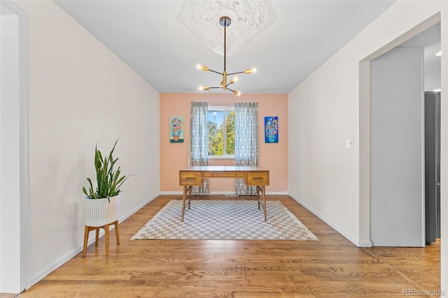 dining space featuring a chandelier and wood-type flooring