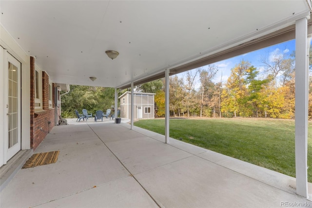 view of patio / terrace with a storage unit