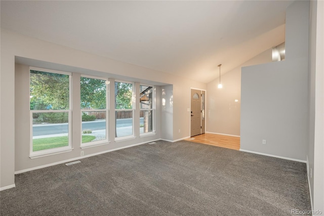 773 S Dearborn Cir, Aurora, CO 80012 - carpeted empty room with plenty of natural light and vaulted ceiling