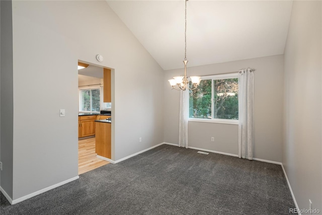 773 S Dearborn Cir, Aurora, CO 80012 - unfurnished room featuring dark colored carpet, a chandelier, lofted ceiling, and a smoke detector