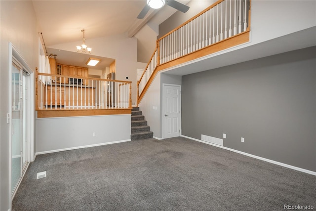773 S Dearborn Cir, Aurora, CO 80012 - unfurnished living room featuring high vaulted ceiling, carpet flooring, a ceiling fan, stairs, and a chandelier