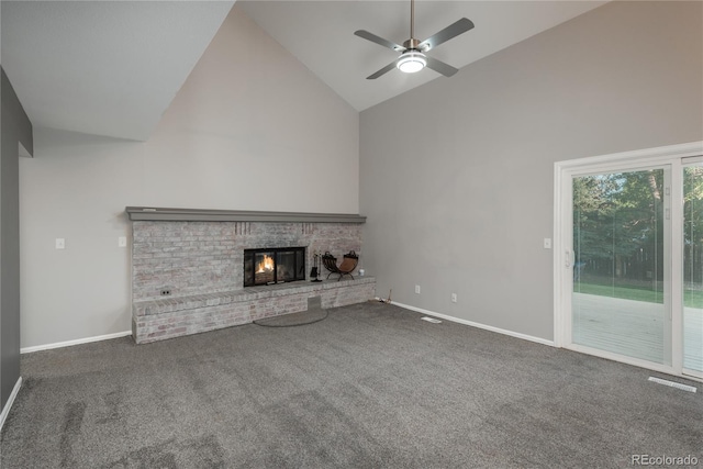 773 S Dearborn Cir, Aurora, CO 80012 - unfurnished living room with high vaulted ceiling, a brick fireplace, carpet floors, and ceiling fan