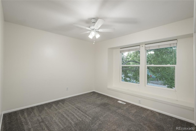 773 S Dearborn Cir, Aurora, CO 80012 - empty room with dark colored carpet and a ceiling fan