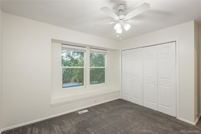 773 S Dearborn Cir, Aurora, CO 80012 - unfurnished bedroom with dark colored carpet, a closet, and ceiling fan