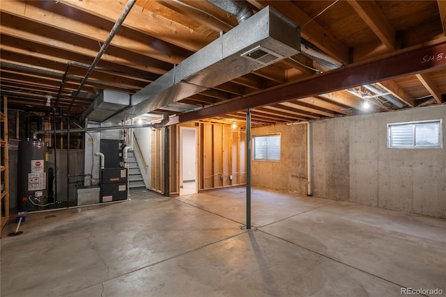 773 S Dearborn Cir, Aurora, CO 80012 - below grade area with water heater, heating unit, and stairway