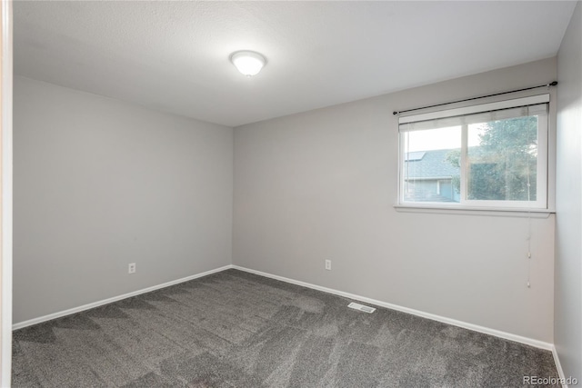 773 S Dearborn Cir, Aurora, CO 80012 - carpeted spare room featuring baseboards
