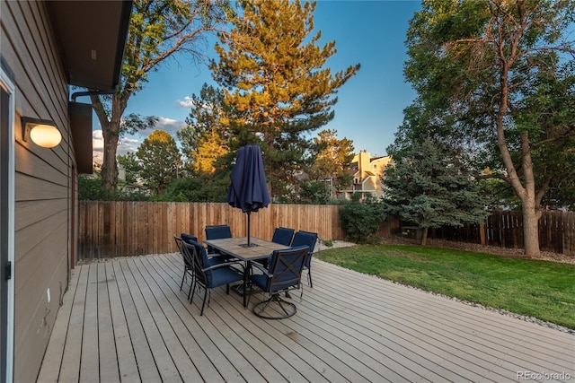 773 S Dearborn Cir, Aurora, CO 80012 - wooden terrace with outdoor dining space and a fenced backyard