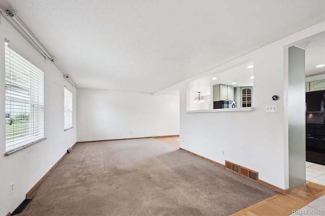 7323 Upham Ct, Arvada, CO 80003 - unfurnished living room featuring recessed lighting and carpet