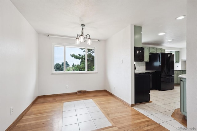 7323 Upham Ct, Arvada, CO 80003 - unfurnished dining area featuring a chandelier, light wood-type flooring, and recessed lighting