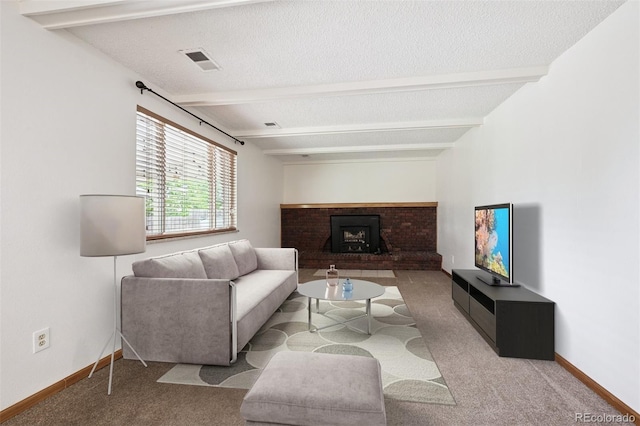 7323 Upham Ct, Arvada, CO 80003 - carpeted living area with beamed ceiling, a brick fireplace, and a textured ceiling