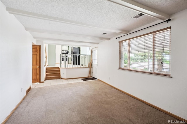 7323 Upham Ct, Arvada, CO 80003 - carpeted spare room featuring beam ceiling, stairway, and a textured ceiling
