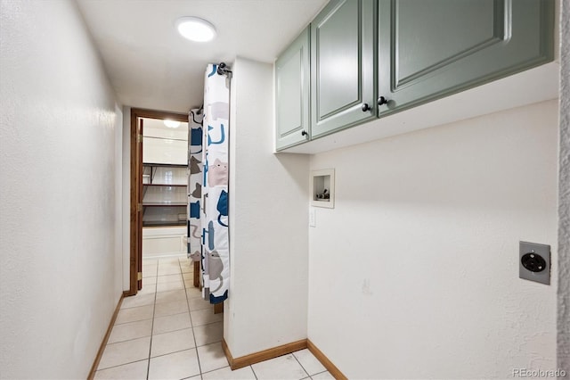 7323 Upham Ct, Arvada, CO 80003 - washroom featuring cabinet space, washer hookup, light tile patterned flooring, and hookup for an electric dryer